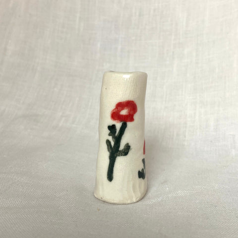 tiny vase with red poppies