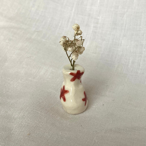 tiny vase with red stars